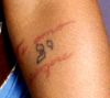 christina aguilera arm tattoos